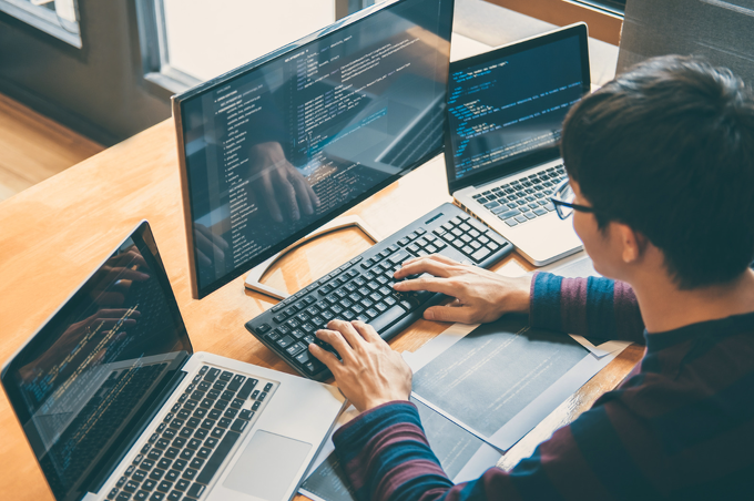 Man coding on computer